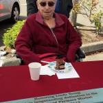 Port Orchard Public Market vendors presented Linda Young with a plaque commemorating her many years as a vendor at the market. Photo: Bob Smith | Kitsap Daily News