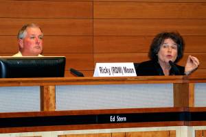 Ricky D. Moon listens as Becky Erickson responds to a question at the Leaguew of Women Voters candidates forum, Oct. 9 in Poulsbo City Hall. Erickson is running for a third term as mayor. Moon, a general contractor, hopes to succeed her.                                Richard Walker/Kitsap News Group