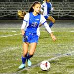 Olympic midfielder Gabby Luty drives the ball upfield during play against North Kitsap on Oct. 13. (Mark Krulish/Kitsap News Group)