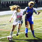 North Kitsap&rsquo;s Abigail Ginn and Olympic&rsquo;s Saoirse Brown (18) fight for the ball during the second half of the Vikings&rsquo; 2-1 victory over the Trojans. (Mark Krulish/Kitsap News Group)