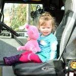 Colette and her cat are ready to drive the firetruck. (Mark Krulish/Kitsap News Group)