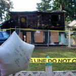 An impromptu memorial outside the Simpson home has been created by neighbors who are grieving over the family&rsquo;s tragedy. Photo: Bob Smith | Kitsap Daily News