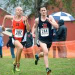 Joshua Geiser (left) of Central Kitsap runs neck-and-neck with William Johnson of Shelton during the boys race at the South Sound Conference championship meet. (Mark Krulish/Kitsap News Group)