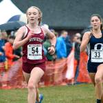 South Kitsap freshman Emma Orser finishes just ahead of Olympia&rsquo;s Kate Riggs during the South Puget Sound League championship meet on Oct. 19. (Mark Krulish/Kitsap News Group)