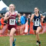 South Kitsap freshman Emma Orser finishes just ahead of Olympia&rsquo;s Kate Riggs during the South Puget Sound League championship meet on Oct. 19. (Mark Krulish/Kitsap News Group)