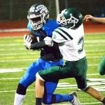 Olympic running Malcolm Dewalt turns the corner against Port Angeles on Oct. 26. The Trojans won the game 59-13. (Mark Krulish/Kitsap News Group)