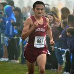 Mark Krulish / Kitsap News Group                                South Kitsap junior Zach Grams heads towards the finish line, fighting through the early morning fog. He finished ninth in the race and his team qualified for the state meet.