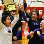 The Vikings celebrate their district volleyball tournament win, their first since 2014 (Mark Krulish/Kitsap News Group)