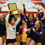 The Vikings celebrate their district volleyball tournament win, their first since 2014 (Mark Krulish/Kitsap News Group)