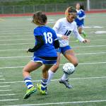 Olympic&rsquo;s Saoirse Brown tries to dribble past her numeral counterpart during a district game against Fife. The Trojans won 4-0. (Mark Krulish/Kitsap News Group)