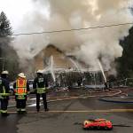 South Kitsap Fire and Rescue douse flames that enveloped a residential structure at the 900 block of Hull Avenue in Port Orchard at about 11:30 a.m. Nov. 7. Bremerton Fire Department assisted to fight the blaze. No one was reported injured. (Photo: South Kitsap Fire and Rescue)