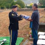 Joe Castro of Los Angeles, a longtime friend of Bob McClelland, receives the U.S. flag from an honor guard sergeant at McClellands Sept. 8 graveside service. (Contributed photo)