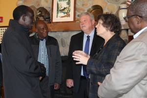 Mayor Becky Erickson welcomes Ugandan Ambassador to the United States Mull S. Katende and a Ugandan delegation Nov. 10 in the Elmers restaurant banquet room. Katende and other Ugandan officials visited Poulsbo as part of a regional tour to develop political and trade relationships. (Richard Walker/Kitsap News Group)