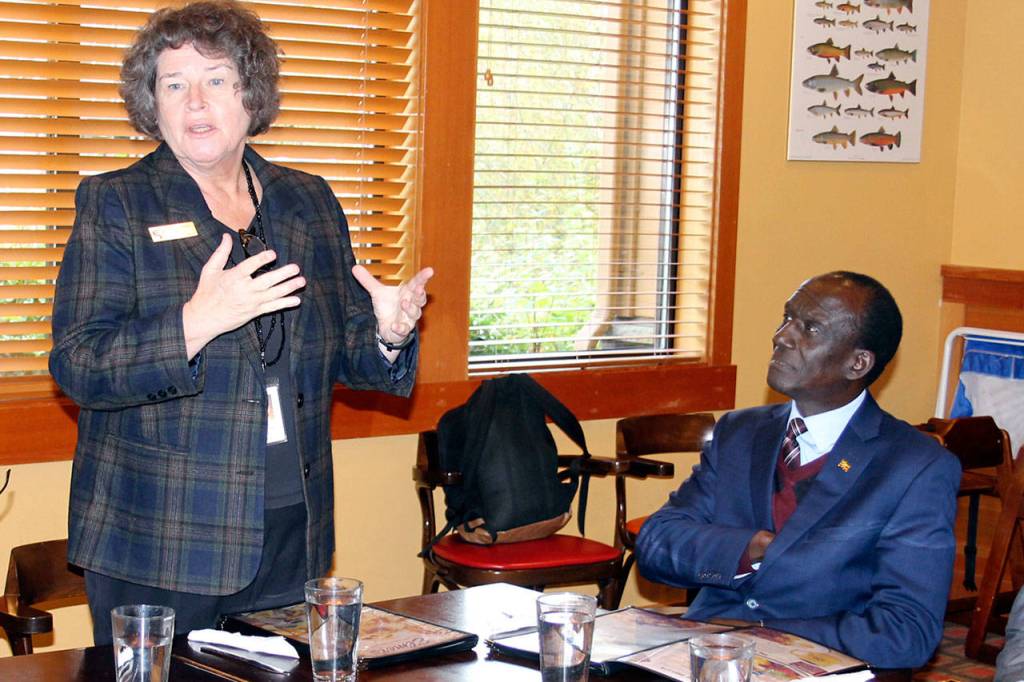Mayor Becky Erickson welcomes Ugandan Ambassador to the United States Mull S. Katende and a Ugandan delegation Nov. 10 in the Elmers restaurant banquet room. Katende and other Ugandan officials visited Poulsbo as part of a regional tour to develop political and trade relationships. (Richard Walker/Kitsap News Group)