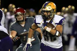 <em>North Kitsaps Dax Solis rushes with Archbishop Murphys John Land-Quinn giving chase Nov. 17 at Veterans Memorial Stadium in Snohomish. </em>Kevin Clark/The (Everett) Daily Herald