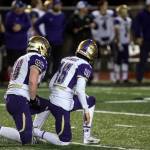 North Kitsaps Ryan Brooks, left, and Andrew Blackmore watch as Archbishop Murphy recovers a fumble for a score Nov. 17 at Veterans Memorial Stadium in Snohomish. (Kevin Clark / The (Everett) Daily Herald)