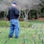 Bob Carter repaired the 600 lights that decorate the Tracyton Community Tree.                                Michelle Beahm / Kitsap News Group