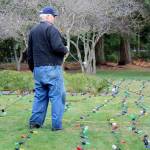Bob Carter repaired the 600 lights that decorate the Tracyton Community Tree.                                Michelle Beahm / Kitsap News Group