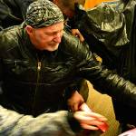 Larry Litsch, a volunteer for the North Kitsap ABATE Toy Run, unpacks a bag full of gifts. (Mark Krulish/Kitsap News Group)