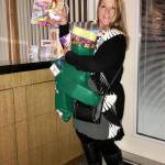 With an armful of stuffed, home-made stockings for the Kingston Food Bank, Kim Clark joins the club for Thanksgiving dinner. Contributed photo