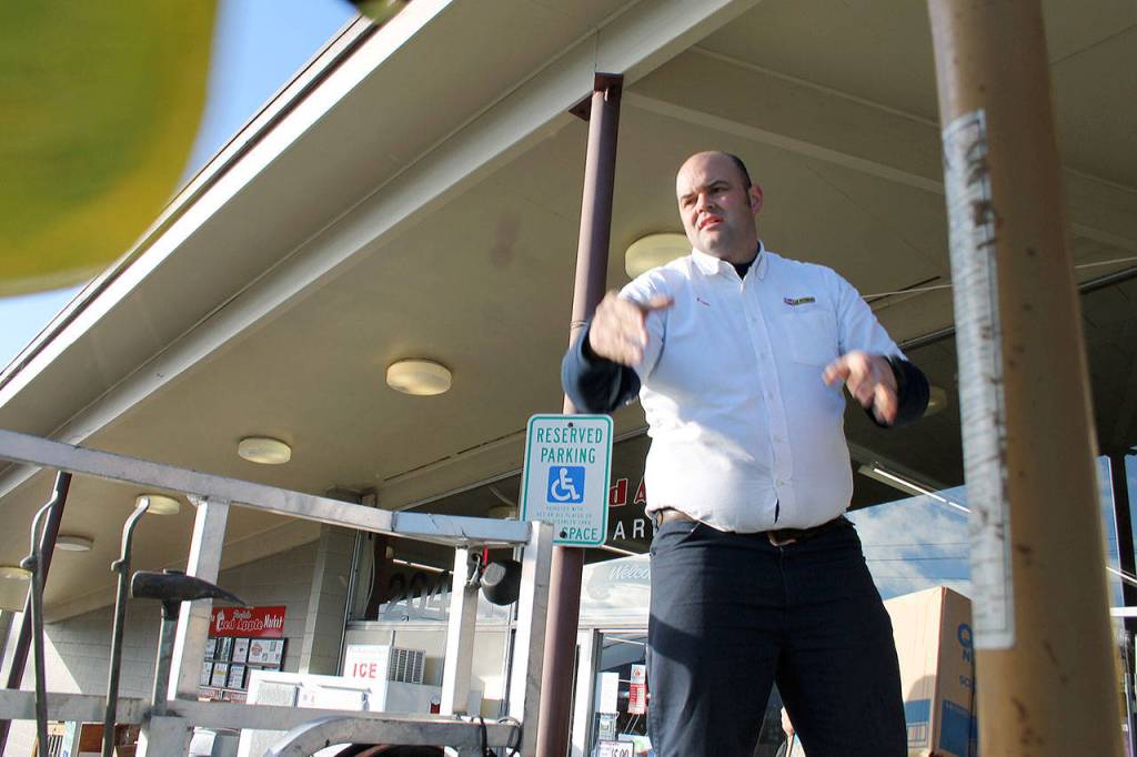 Scott Kelly of the Port Orchard Les Schwab Tire Center loads paper towels onto a truck for delivery to Food Lifeline, Nov. 17. (Richard Walker/Kitsap News Group)