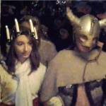 The Lucia Bride, Kaitlyn Bell, arrives under Viking escort to the Julefest bonfire, Dec. 2 at Muriel Iverson Williams Waterfront Park. (Richard Walker/Kitsap News Group)