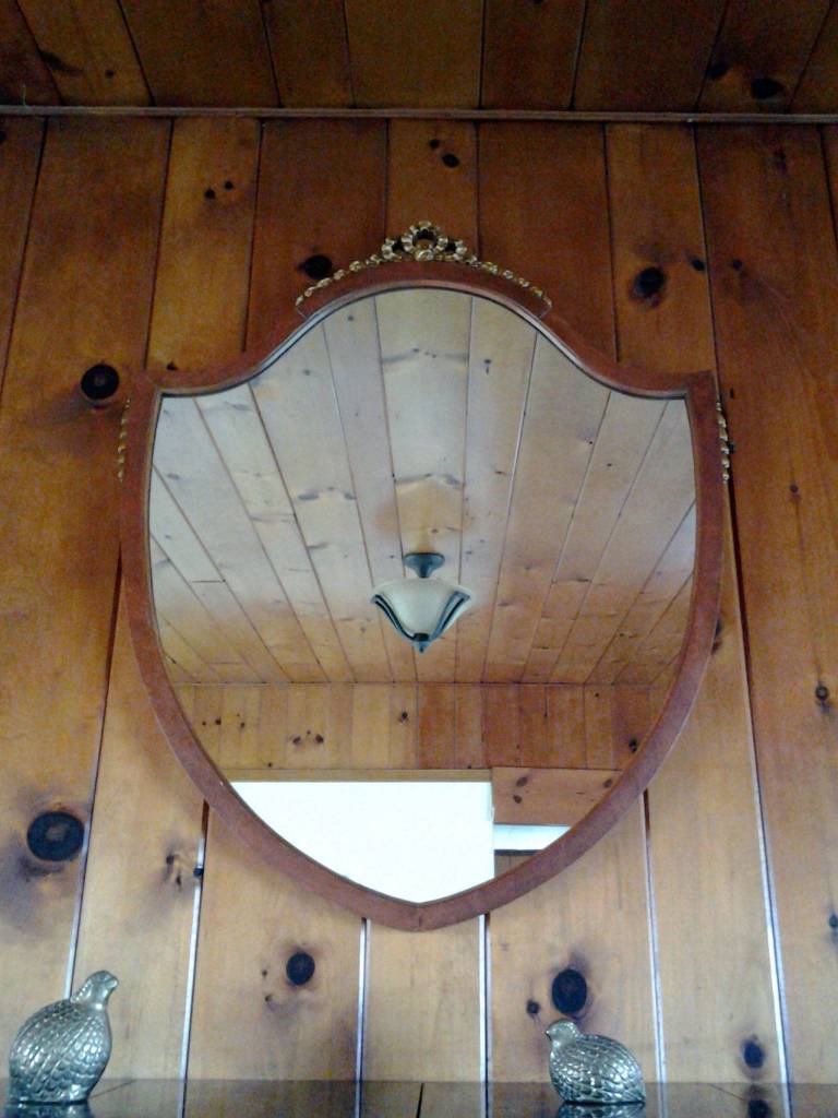 An antique mirror catches the reflection of the antique ceiling light in the Maggs House living room. (Richard Walker/Kitsap News Group)                                 An antique mirror catches the reflection of the antique ceiling light in the Maggs House living room. (Richard Walker/Kitsap News Group)