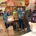 Volunteers work at ShareNets food bank, preparing for clients to shop for groceries.                                Contributed photo