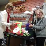 From left, Fishline volunteers Linda Drew Fritz and Jean Haller sort donated items before Second Season Thrift Store opens Dec. 6. The thrift store is moving from 2,000-square-foot space on Anderson Parkway to a 5,000-square-foot site in Poulsbo Village. (Richard Walker/Kitsap News Group)