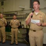 U.S. Navy Capt. Kevin Lenox, commanding officer of the aircraft carrier USS Nimitz (CVN 68), speaks prior to a frocking ceremony in the ships hangar bay, Nov. 24 in the Pacific Ocean. Four hundred crew members were promoted in the ceremony. (Mass Communication Specialist 3rd Class Cole Schroeder/U.S. Nacvy)