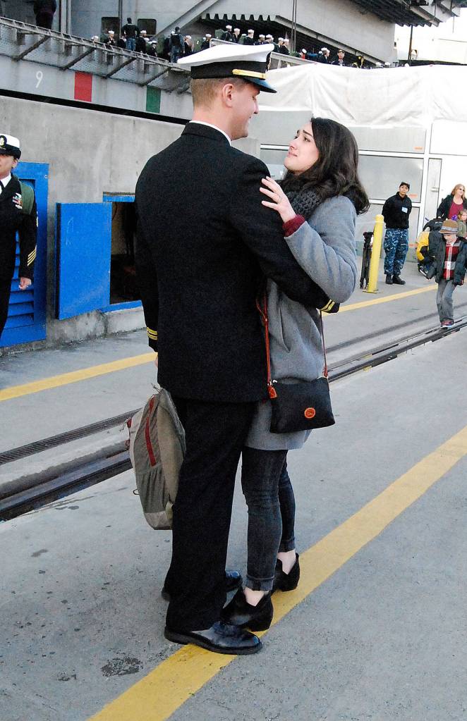 The long wait is over for newlywed Holly Carlson as she and her husband Nicolai embrace. (Photo: Bob Smith | Kitsap Daily News)