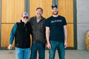 Kiona Vineyards and Winery on Red Mountain was founded in 1975 by John Williams, left, and now is operated by his son, winemaker/grower Scott Williams, and grandson/general manager JJ Williams. (Photo courtesy of Kiona Vineyards and Winery)