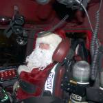 Santa Claus rides shotgun in the firetruck as it approaches Kingstons Mike Wallace Park. Nick Twietmeyer | Kitsap News Group.