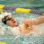 <em>Kingston junior Timothy Gallagher performs the backstroke during the 200 yard individual medley against North Kitsap. Gallagher finished with a time of 1:53.91, which qualified him for the state meet in that event. </em>                                Mark Krulish/Kitsap News Group