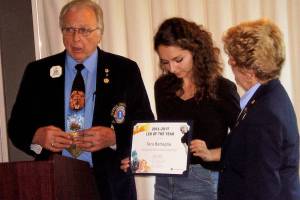 <em>Tara Battaglia receives the Leo of the Year award for Lions Multiple District 19 from Past Council Chairman Enoch Rowland. Looking on is Past District Governor Jan Weatherly.</em>                                Contributed photo