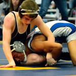 Mark Krulish | Kitsap News Group                                South Kitsap freshman Xavier Eaglin wrestles with Olympics Anjelo Pangelinan in the 106 finals at the HammerHead Invitational on Dec. 16.