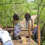 Members of the Poulsbo Lions build a boardwalk in Fish Park in Poulsbo.                                Contributed photo