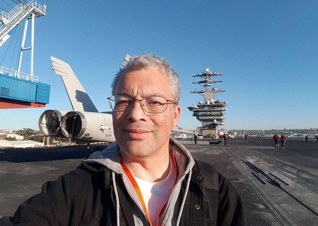 Correspondent Robert Zollna, standing on-deck on the USS Nimitz, traveled on the aircraft carrier to its home base in Bremerton. (Photo: Robert Zollna | Kitsap Daily News)