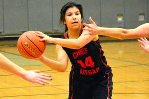 <em>Chief Kitsap Academy sophomore Miya Smith looks to make a bounce pass against Klahowya on Dec. 19. </em> Mark Krulish/Kitsap News Group