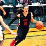<em>Austin Wion dribbles in from the wing to take the ball to the basket against the Eagles defense. </em>Mark Krulish/Kitsap News Group