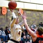 <em>Kingston senior Avy Hiner (4), lets go of a shot as shes surrounded by Central Kitsap defenders in her teams 59-49 victory on Dec. 20.</em>Mark Krulish/Kitsap News Group