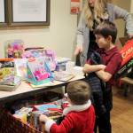 Zachary Darner founded Kidzz Helping Kidzz to collect donations of toys for gifting to children in three area hospitals. This year, the group collected and delivered more than 1,500 toys. (Courtesy photos)