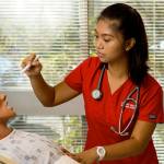 Nursing student Juvylyn Purificacion uses a medical mannequin to practice her assessment skills in Olympic Colleges nursing simulation lab. (Contributed photo)
