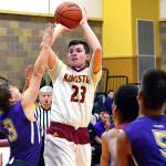 <em>Kingston junior Michael Vallejo attempts a jumper over several Sequim defenders in his teams 53-38 loss on Jan. 4.</em>                                Mark Krulish/Kitsap News Group