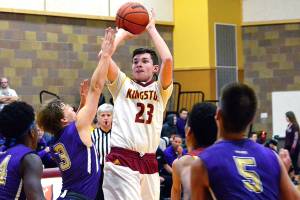 <em>Kingston junior Michael Vallejo attempts a jumper over several Sequim defenders in his teams 53-38 loss on Jan. 4.</em>                                Mark Krulish/Kitsap News Group