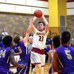 <em>Kingston junior Michael Vallejo attempts a jumper over several Sequim defenders in his teams 53-38 loss on Jan. 4.</em>                                Mark Krulish/Kitsap News Group