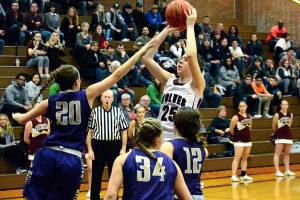 South Kitsap junior forward Emma Erickson (25) puts up a shot over the Puyallup defense during the Wolves 52-44 win on Jan. 5. (Mark Krulish/Kitsap News Group)
