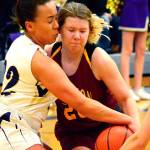 <em>Kingstons Sierra Denning (20) tries to muscle past Olivia Selembo and Katie Hughes (24) of North Kitsap on Jan. 9. The Vikings won the game 50-40.  </em>Mark Krulish/Kitsap News Group