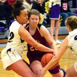 <em>Kingstons Sierra Denning (20) tries to muscle past Olivia Selembo and Katie Hughes (24) of North Kitsap on Jan. 9. The Vikings won the game 50-40.  </em>Mark Krulish/Kitsap News Group