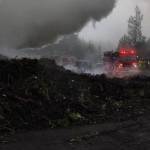 North Kitsap Fire & Rescue firefighters had contained a stump pile fire near Hansville around noon, but reported that the fire was stubborn, so firefighters would likely be on scene throughout the day.                                NKF&R/Courtesy